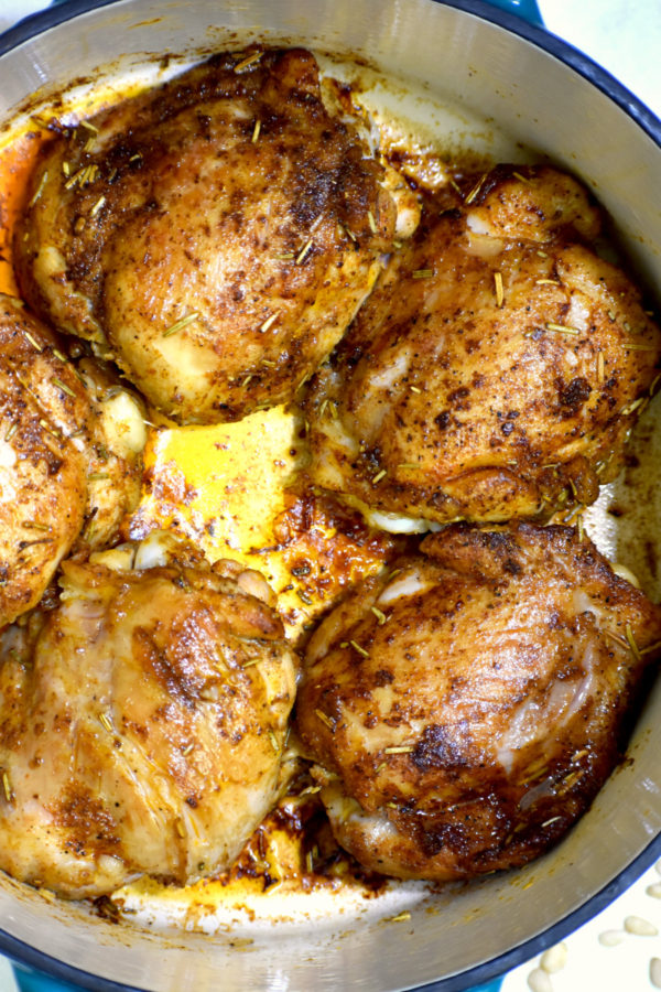 five chicken thighs nicely browned in a dutch oven