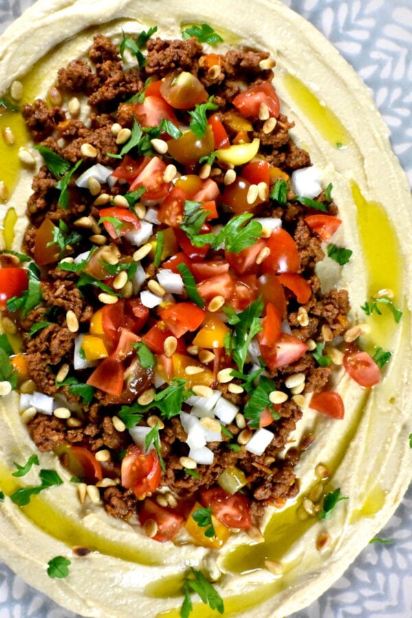 Dress up your hummus like never before… Get that scooping going with this beautiful, bright and colorful Loaded Layered Hummus Dip. This luscious loaded hummus is perfect for your party or potluck appetizer.